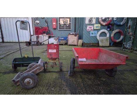 A steel constructed dump-truck, attachment for Westwood ride-on tractor, 108x74cm, together with two seed spreaders and a pai