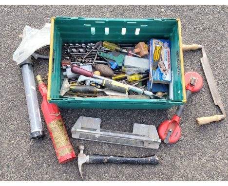 A selection of carpentry hand tools to include a shoulder plane, screwdrivers, chisels, hammer, auger drill bits, tile cutter
