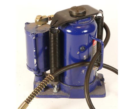 A 20 ton air/manual hand jack, appears unused.