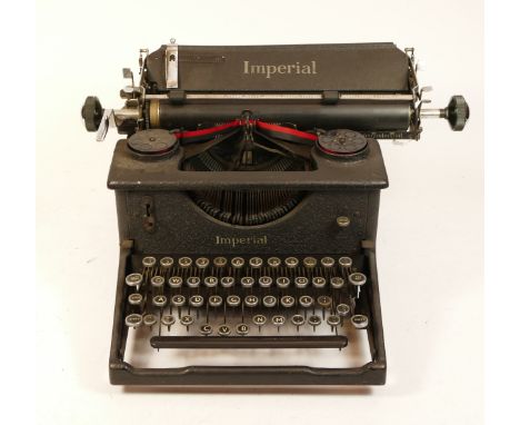 An early 20th century Imperial typewriter, with cover.