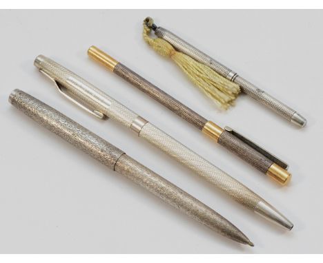 A silver ball point pen, by J.White &amp; Co, Birmingham 1995, together with another silver ballpoint pen, London 1975, a sil