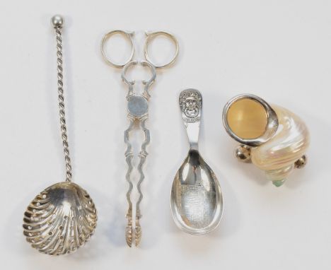 A cast silver pair of sugar tongs, Sheffield 1964, together with a silver caddy spoon, embossed with Durham cathedrals sanctu