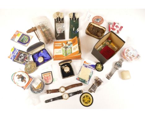 An assortment of collectable items, to include, watches, darts, and old coinage.