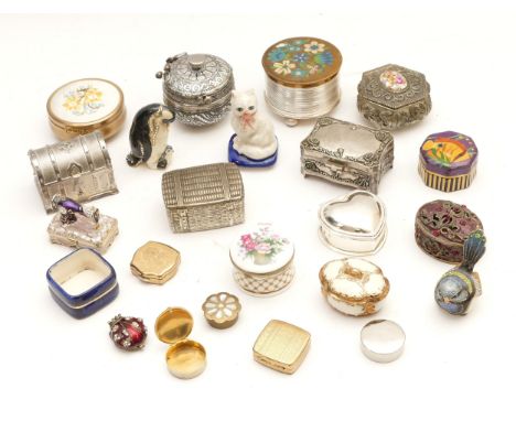 Twenty-two trinket boxes, porcelain and metalware, to include, a Falcon China example and a Reuge example with music box mech