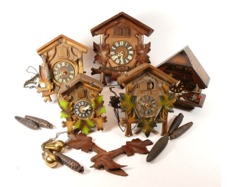 A collection of mid-twentieth century Black Forest cuckoo clocks, having single and twin train manual wind movement, suitable
