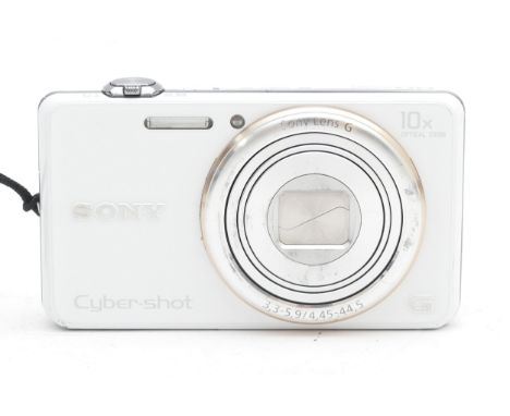 A Sony Cyber-Shot compact digital camera, model no. DSC-WX100, in original box.