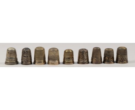 Eight various silver thimbles together with a sterling silver 'The Spa' thimble, 40gm (9)