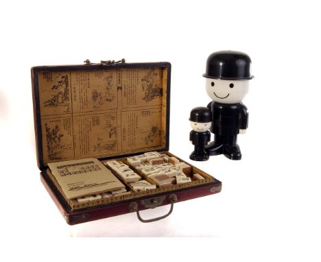A modern boxed mah-jongg set, the pieces made from bone laid on wood, in decorative oriental style box, together with a four 