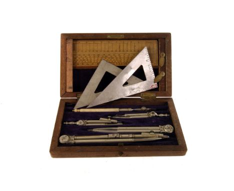 A Department of Science and Art cased geometry set, the fitted case containing geometry equipment, including a ruler, set squ