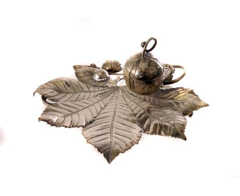 A fine Art Nouveau period silver plated inkwell, naturalistically modelled as a horse chestnut leaf with conker inkwell on co