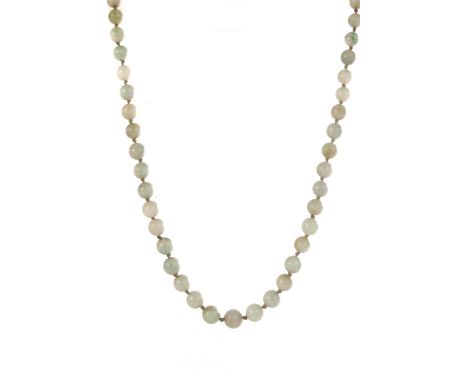 A green jade bead necklace, the graduated beads ranging from 4mm to 9mm, approx 50cm in length