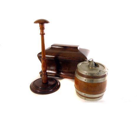 A pair of 19th century mahogany wig stands, together with an oak barrel biscuit barrel and a mahogany tea caddy (4)