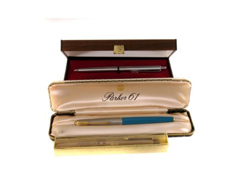 A cased Parker 61 fountain pen, together with a Papermate roller ball pen and a Germany Underground Hospital pen (4)