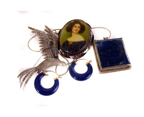 A white metal and porcelain portrait brooch, with transfer printed image of a lady, together with a marcasite set seagull bro