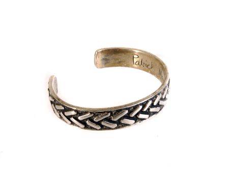 A modern silver Gent's torsion bracelet by Patrick Mavros, having herring bone design, dated 2000