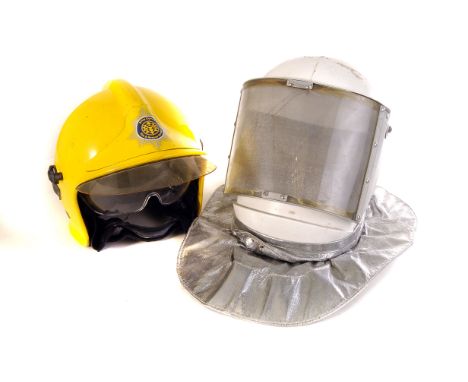 A modern Gallet industrial fire helmet, for Amey Comax Fire & Rescue Service, the yellow helmet having two visors, one to cov