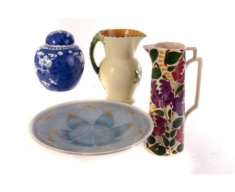 An assortment of various ceramics, including an oriental blue and white ginger jar, a Wade 'Harvest' decorated water jug, a B