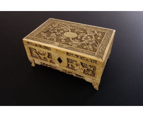 An Art Deco period carved ivory trinket box, having pierced bird amongst foliate design, AF, in wooden box