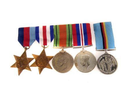 A group of WWII medals, including the War and Defence medals, the 1939-45 Star, the France and Germany Star and the Faithful 