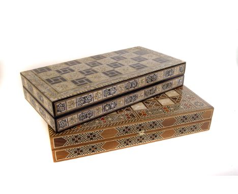 Two inlaid games compendiums, one having mother of pearl inlaid design the other a mosaic style design, both having chess/che