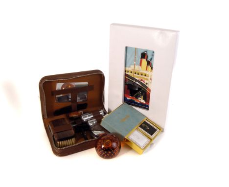 A selection of various works of art, to include a part geometry set, a vintage gents travelling set, a glass paperweight, a h