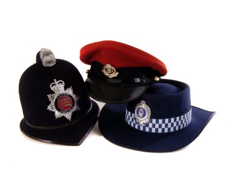 A selection of British and Australian police hats and caps, including Royal Military police, male and female traffic police, 