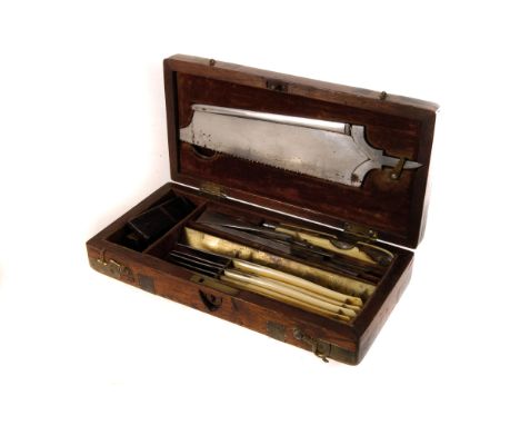 A late 19th century Ferguson post mortem set, comprising a bone saw, various ivory handled scalpels, scissors and other instr