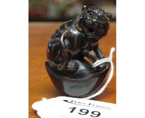 Carved hardwood Japanese netsuke with signature to base of a big cat snarling.(B.P. 24% incl. VAT)