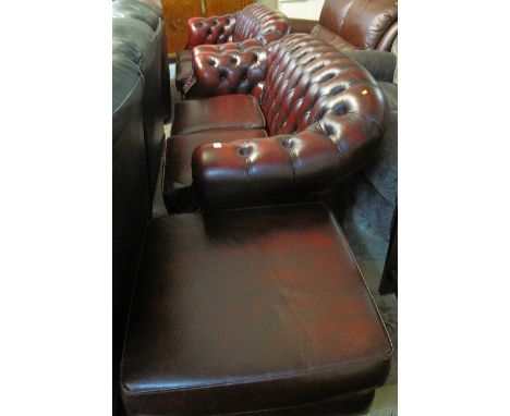 Modern Burgundy Chesterfield style three piece suite comprising two two seater sofas and a square footstool. (3)(B.P. 24% inc