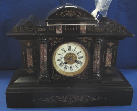 Late 19th/early 20th Century slate and marble architectural two train mantel clock with Roman numeral chapter ring and having
