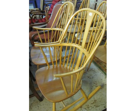 Set of six Ercol light elm and beech spindle backed dining chairs, and two similar rocking chairs. (8)(B.P. 24% incl. VAT)   