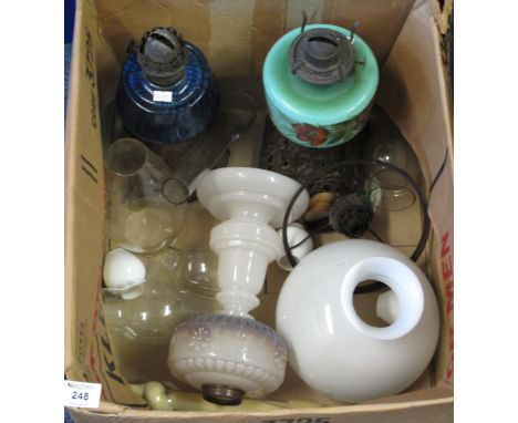 Box of assorted glass to include two early 20th Century oil lamp burners together with various shades and funnels.(B.P. 24% i