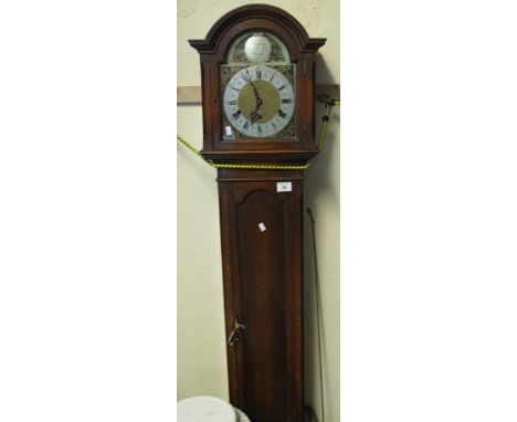 Mid 20th Century oak two train grandmother clock with arched brass face, having silver chapter ring. Pendulum and key.(B.P. 2