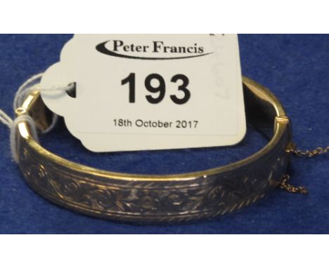 9ct gold scroll engraved bangle, 12g approx.(B.P. 24% incl. VAT)