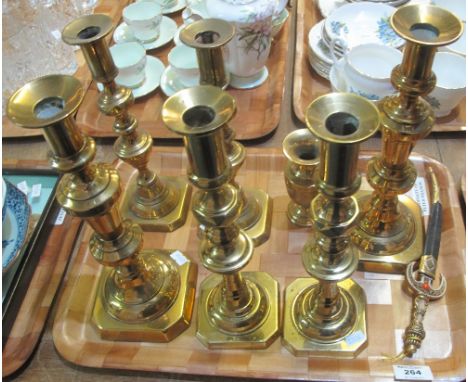 Tray of various pairs of brass candlesticks, together with a small Middle Eastern design baluster vase and a Middle Eastern r