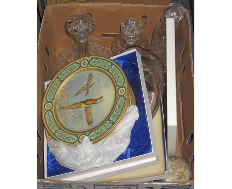 Tray of assorted items to include: musical trinket box; glass decanters and stoppers; silver plated cake basket; Wedgwood col