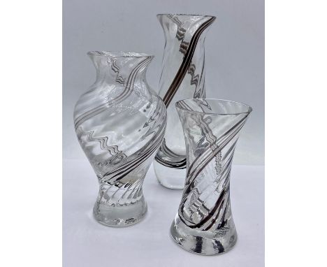 A selection of three Caithness encased glass vases