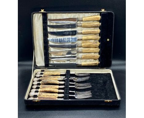 A Harrison Fisher Trafalgar design stainless steel knife and fork set, boxed Sheffield 