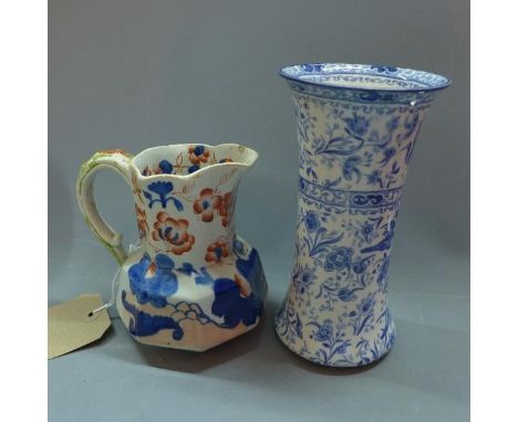 A 19th century Newcastle ceramic jug together with a ceramic vase. 