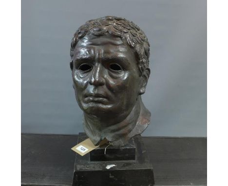 A bronze bust of a Classical man, raised on stepped base, H. 49cm 