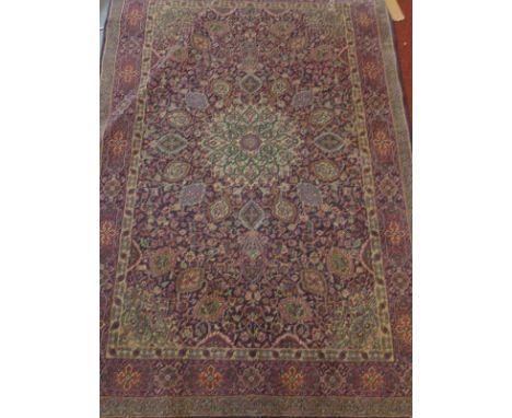 A Persian Kashan carpet, signed. 185cm x 122cm 