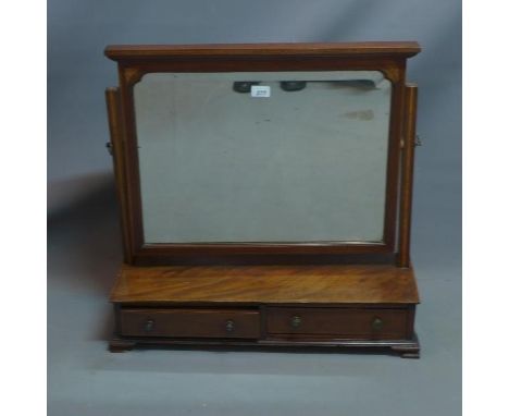 An Edwardian mahogany vanity mirror, with two drawers, beveled glass plate, raised on bracket feet. H-66 W-69 D-24cm 