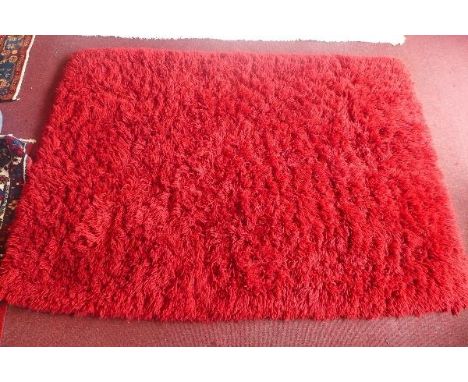 A Gooch Oriental Contemporary red woolen shag pile carpet, 'Yeti' range. 240 x 171cm 