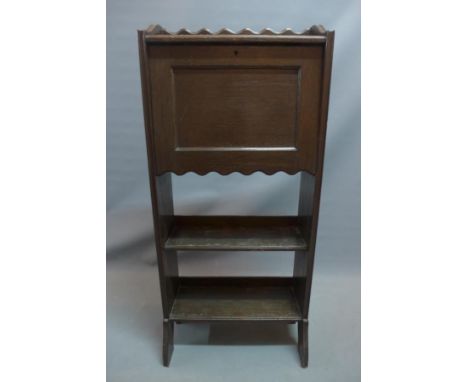 A 20th century oak bureau bookcase with drop flap above shelf space. H-116 W-53 D-25cm 