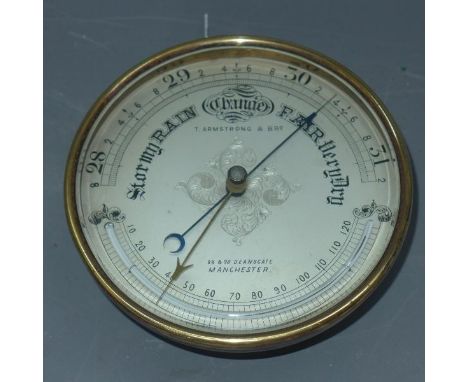 An early 20th century bras barometer signed Thomas Armstrong & Bro 