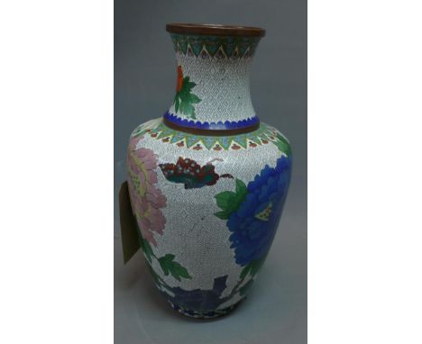 A 20th century Chinese cloisonne enamel baluster vase, with everted rim, polychrome decorated with flowers on a geometric pat