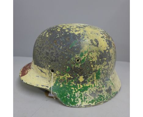 A German helmet shell relic, size 64, post war paint 