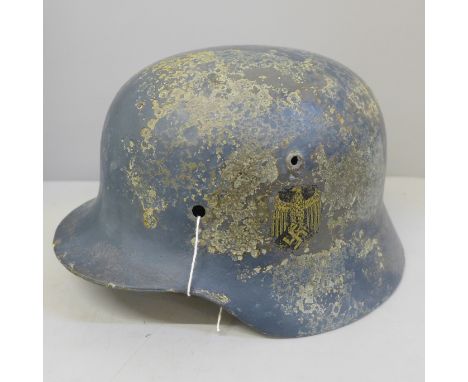 A German WWII SE64 helmet shell, post war decal 