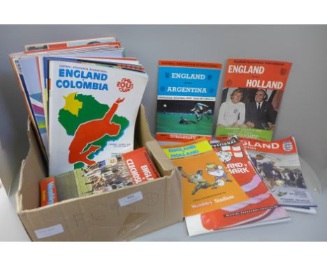 Sporting memorabilia; a collection of England home football programmes and three books 