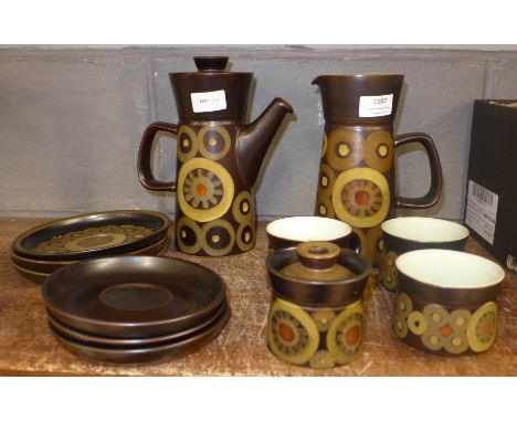 A Denby Arabesque part coffee set including coffee pot, jug, lidded sugar and three trios of cups, saucers and side plates (1